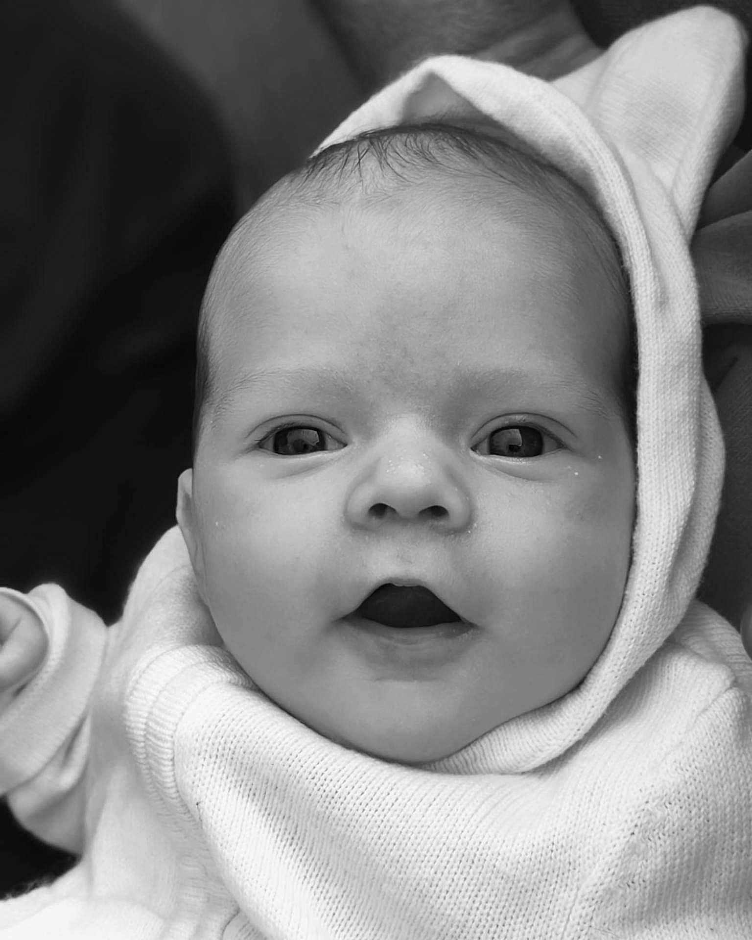 Juliette participe au concours pour gagner de l'argent avec cette photo : baby, infant, face, hood, knitwear, portrait, closeup, newborn, expression, cute, child, soft, warm, sweater, person, young, skin, eyelashes, mouth, eyes