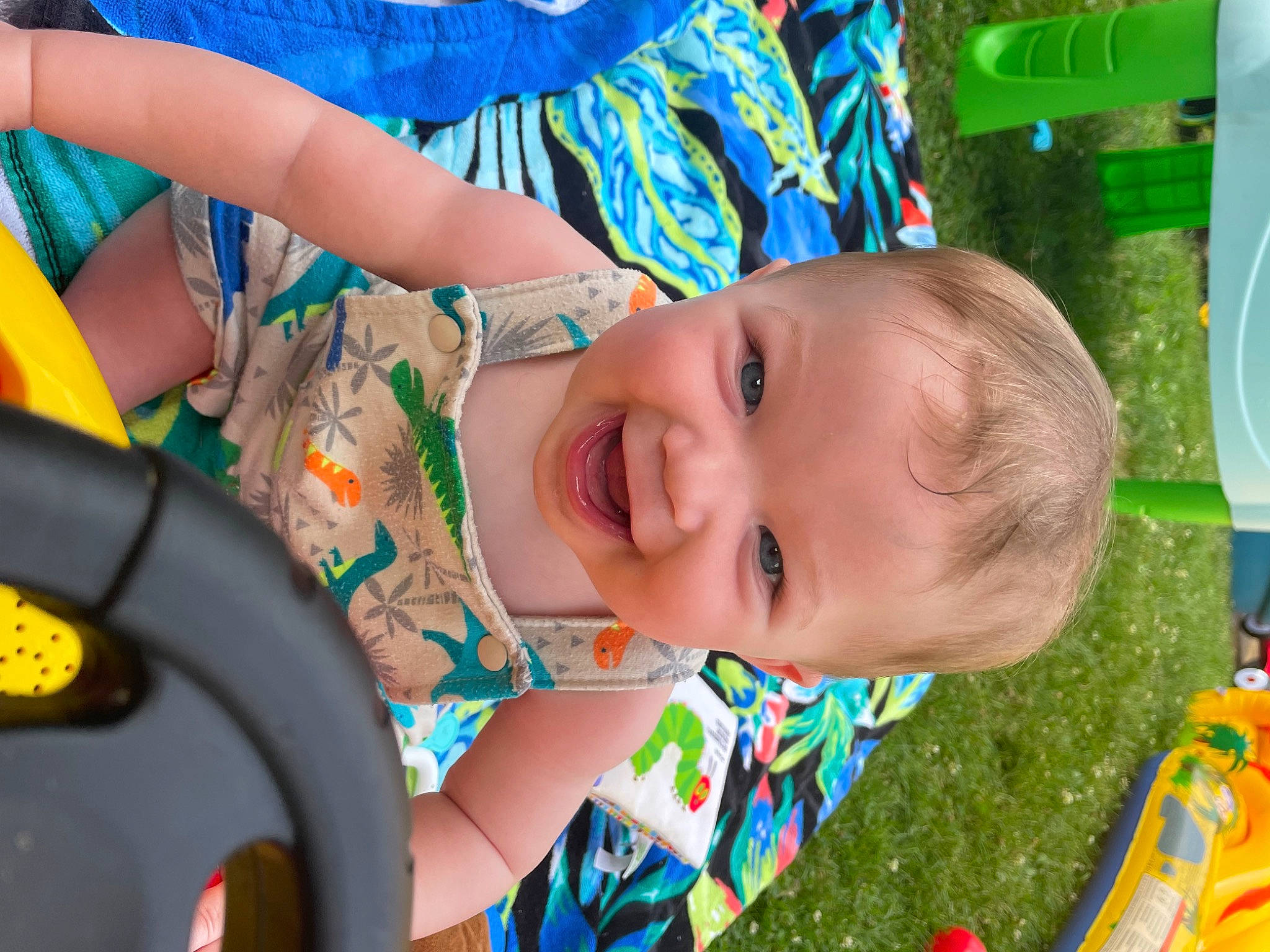 Houston is registered to the contest to win money with this photo: azure, baby, baby_products, baby_toddler_clothing, blue, child, facial_expression, fun, grass, happy, iris, leisure, people_in_nature, person, product, recreation, skin, smile, toddler, tree