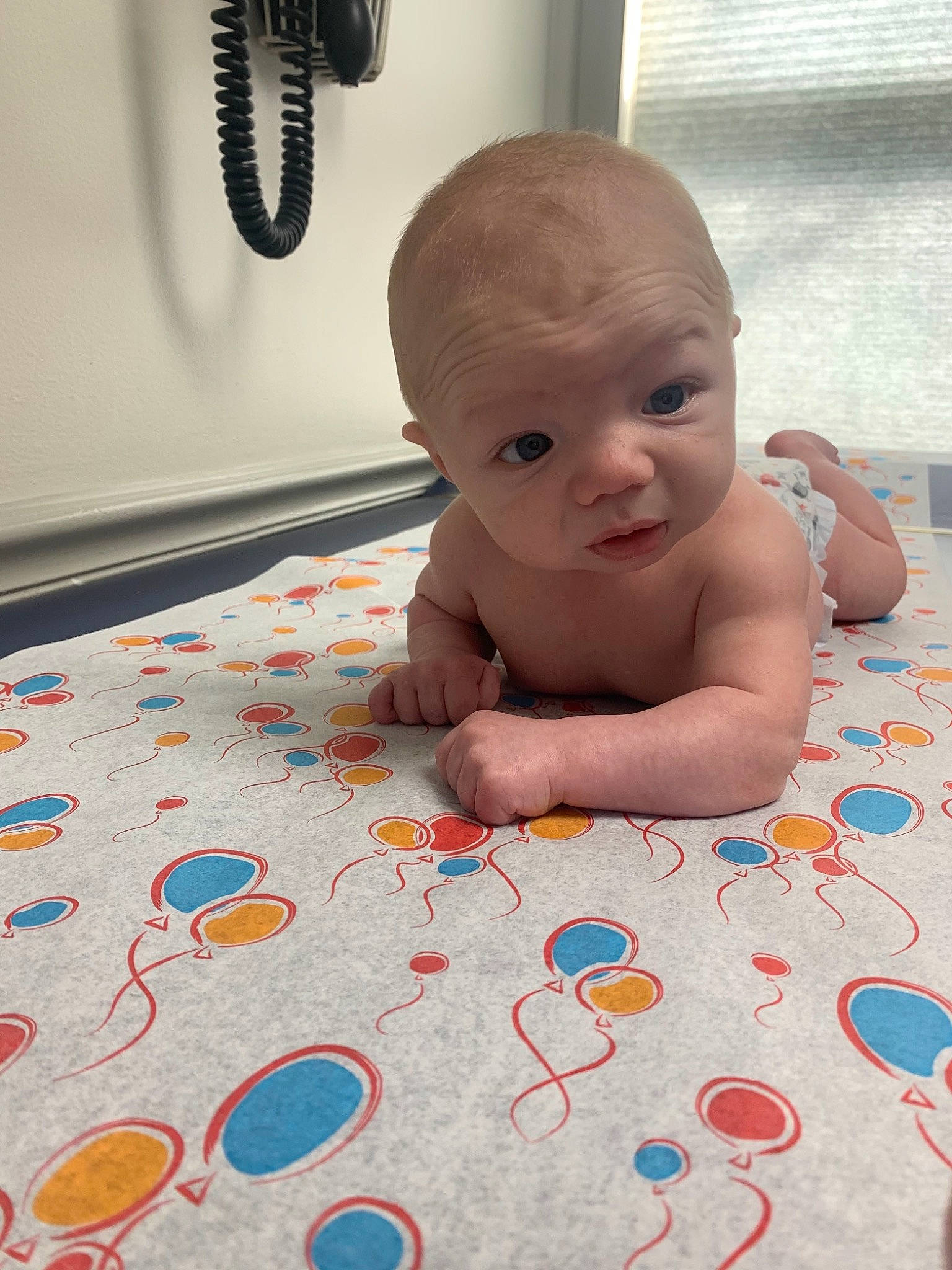 Colton is registered to the contest to win money with this photo: art, baby, baby_toddler_clothing, cheek, child, crawling, finger, floor, flooring, fun, happy, linens, pattern, person, product, room, skin, smile, toddler, tummy_time