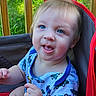 Nathan is registered to the contest to win money with this photo: toddler, child, blue_eyes, smiling, tongue_out, short_hair, striped_shirt, car_print, sitting, red_chair, outdoor, wooden_railings, green_grass, baby, cute, portrait, happy, person, casual_clothing, sunlight
