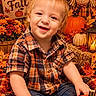 Nathan is registered to the contest to win money with this photo: autumn, baby, child, fall, flowers, happy, harvest, hay, indoor, jeans, lantern, leaves, plaid_shirt, portrait, pumpkin, scarecrow, seasonal_decor, smiling, toddler, wooden_sign