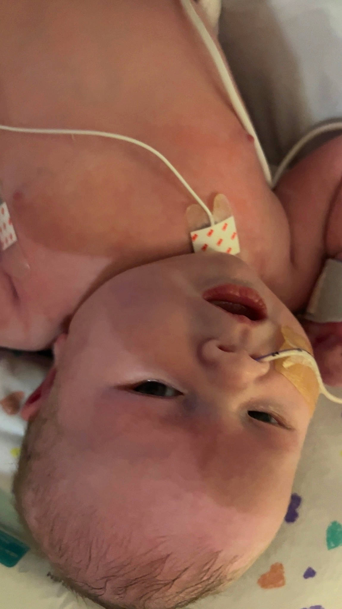 Paisley is registered to the contest to win money with this photo: baby, cheek, chest, ear, eyebrow, eyelash, face, finger, forehead, gesture, happy, head, human_body, jaw, lip, mouth, neck, nose, person, skin