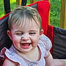 Isabella joined the competition — help win amazing prizes! baby, child, smiling, happy, face, outdoor, grass, wooden_rail, chair, red, clothing, cute, infant, portrait, sitting, person, nature, daylight, joy, fun