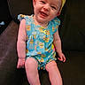 Isabella joined the competition — help win amazing prizes! baby, child, smiling, headband, romper, sitting, couch, indoors, happy, cute, infant, face, legs, arms, popsicle_pattern, yellow, blue, clothing, person, portrait