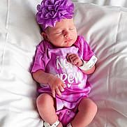 Isabella joined the competition — help win amazing prizes! baby, newborn, infant, sleeping, purple_flower, headband, hospital_bracelet, onesie, pink_clothing, white_sheet, bed, blanket, portrait, closeup, skin, hands, feet, legs, peaceful, hospital_id_band
