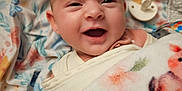Isabella joined the competition — help win amazing prizes! baby, bedding, blanket, cheerful, close_up, cute, eyes, face, floral_pattern, human, infant, mouth_open, newborn, nursery, pacifier, plush, portrait, skin, smiling, swaddle