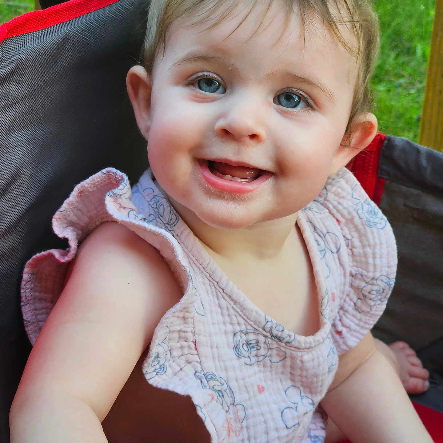 Isabella joined the competition — help win amazing prizes! baby, child, smiling, blue_eyes, outdoor, greenery, chair, clothing, pink_outfit, cute, portrait, happy, person, face, infant, sitting, sunlight, nature, closeup, young