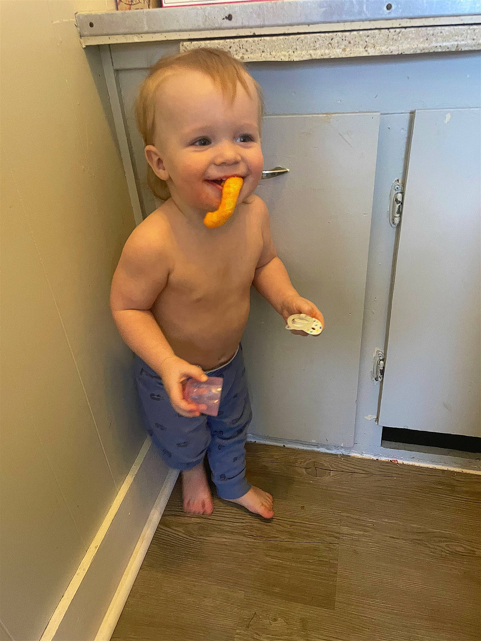 Blake is registered to the contest to win money with this photo: baby, barefoot, chest, child, door, elbow, floor, flooring, foot, fun, gas, hardwood, human_leg, joy, person, room, standing, thumb, toddler, wood