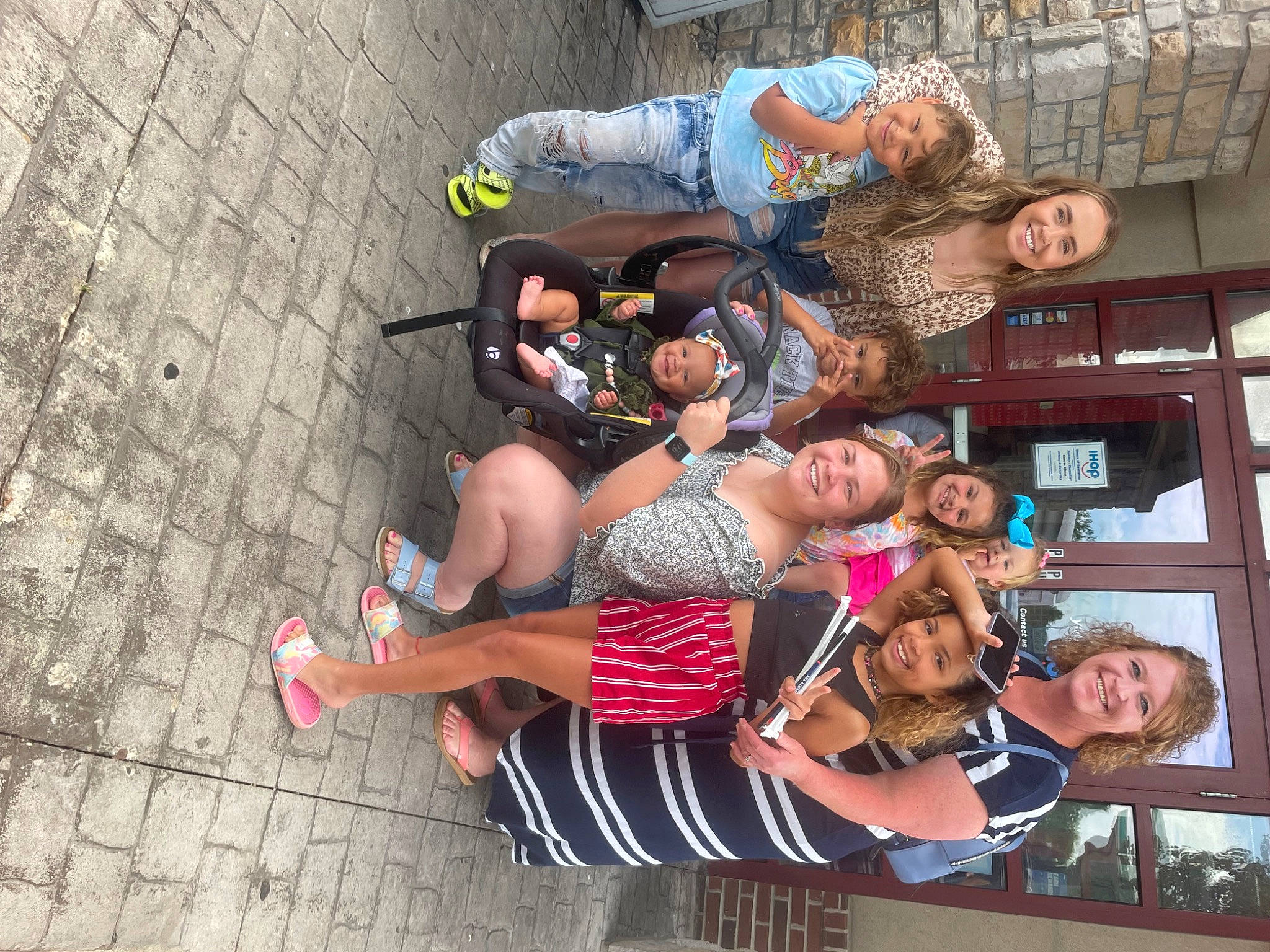 London is registered to the contest to win money with this photo: arm, event, eyewear, fun, hand, happy, hat, headwear, human_leg, joy, leisure, people, person, recreation, shoe, shorts, smile, t_shirt, team, thigh