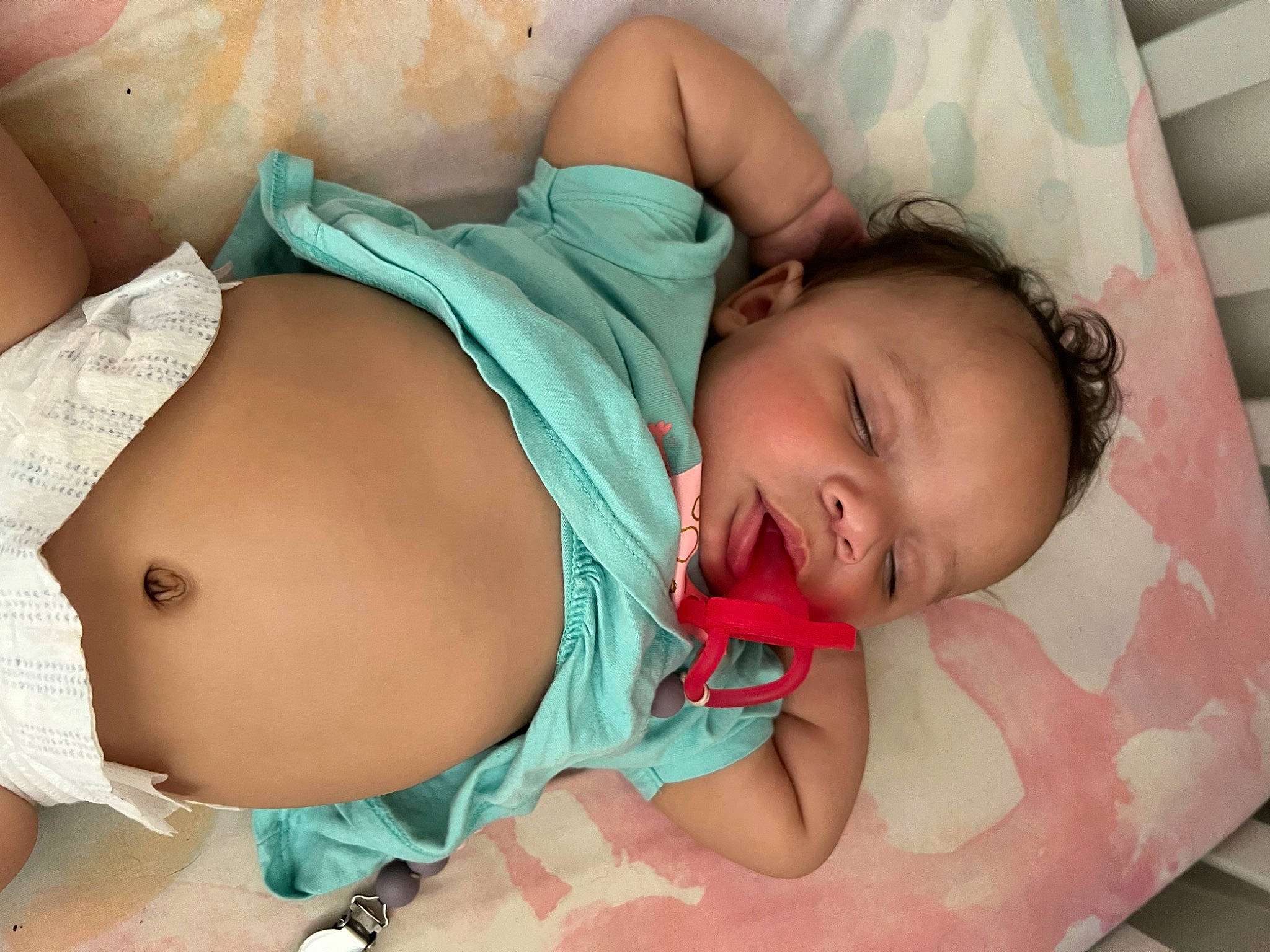 London is registered to the contest to win money with this photo: abdomen, baby, baby_products, baby_sleeping, baby_toddler_clothing, bedtime, cheek, chest, child, comfort, human_leg, joint, linens, mouth, pattern, person, room, skin, stomach, thigh