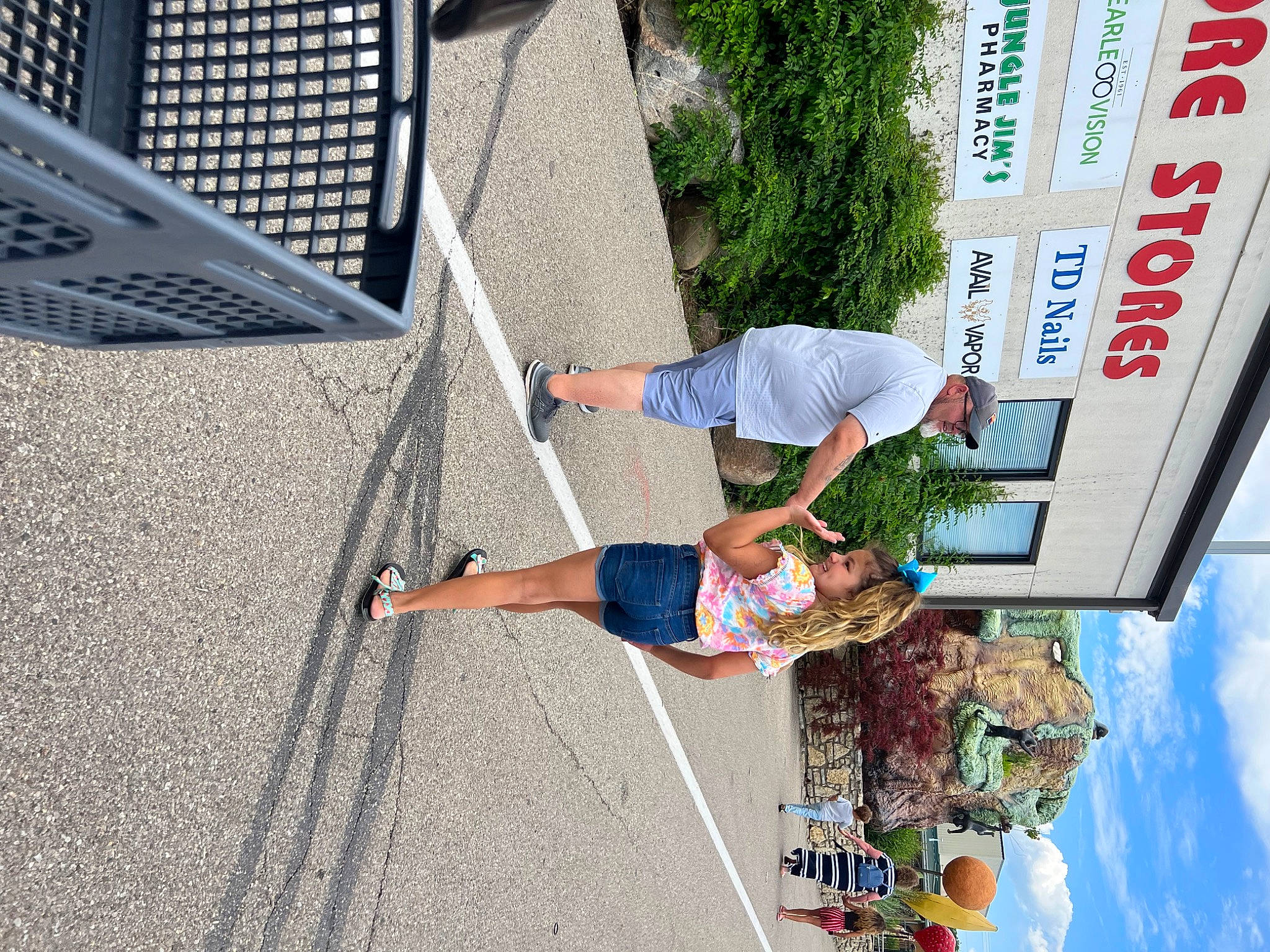 Jazmine is registered to the contest to win money with this photo: adventure, advertising, arm, clothing, denim, facade, fun, headwear, joy, leisure, mesh, outdoor_shoe, pedestrian, person, plant, recreation, shorts, sky, t_shirt, tree