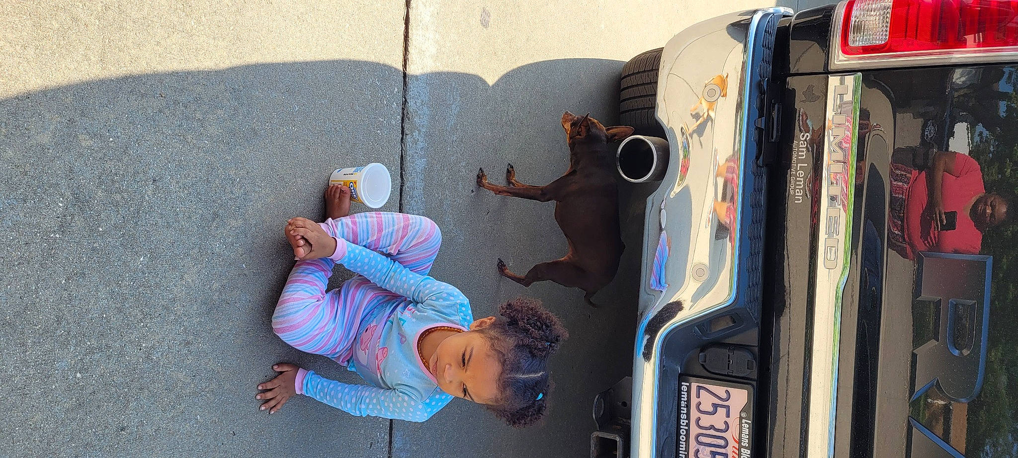 Kya is registered to the contest to win money with this photo: art, automotive_design, automotive_exterior, car, concrete, dog, facade, hat, joy, leisure, machine, motor_vehicle, person, recreation, sidewalk, street, street_fashion, t_shirt, tire, vehicle_door