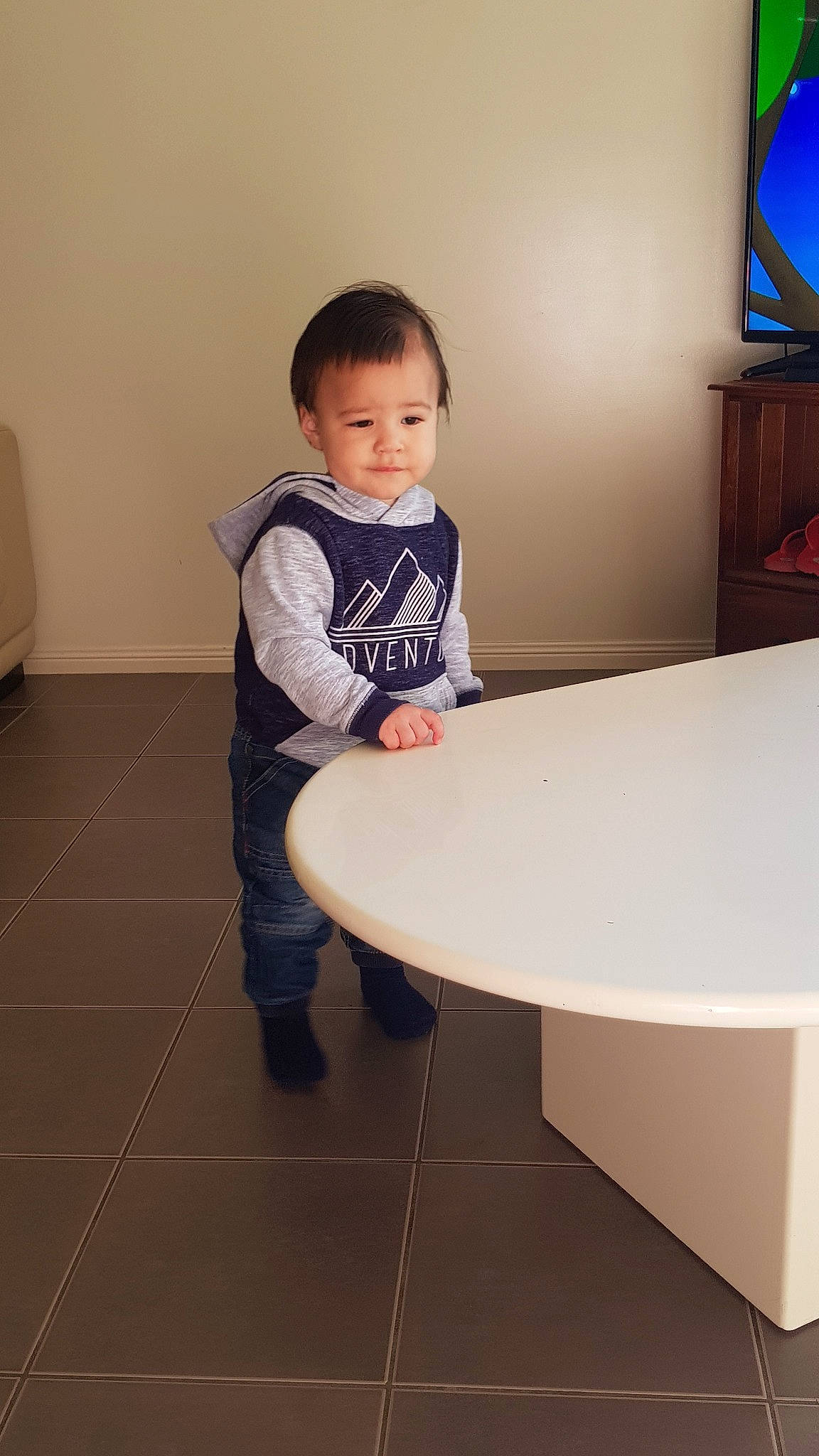 Zavier joined the competition — help win amazing prizes! baby, child, floor, flooring, fun, furniture, leg, person, play, room, sitting, skin, smile, standing, table, toddler, vacation