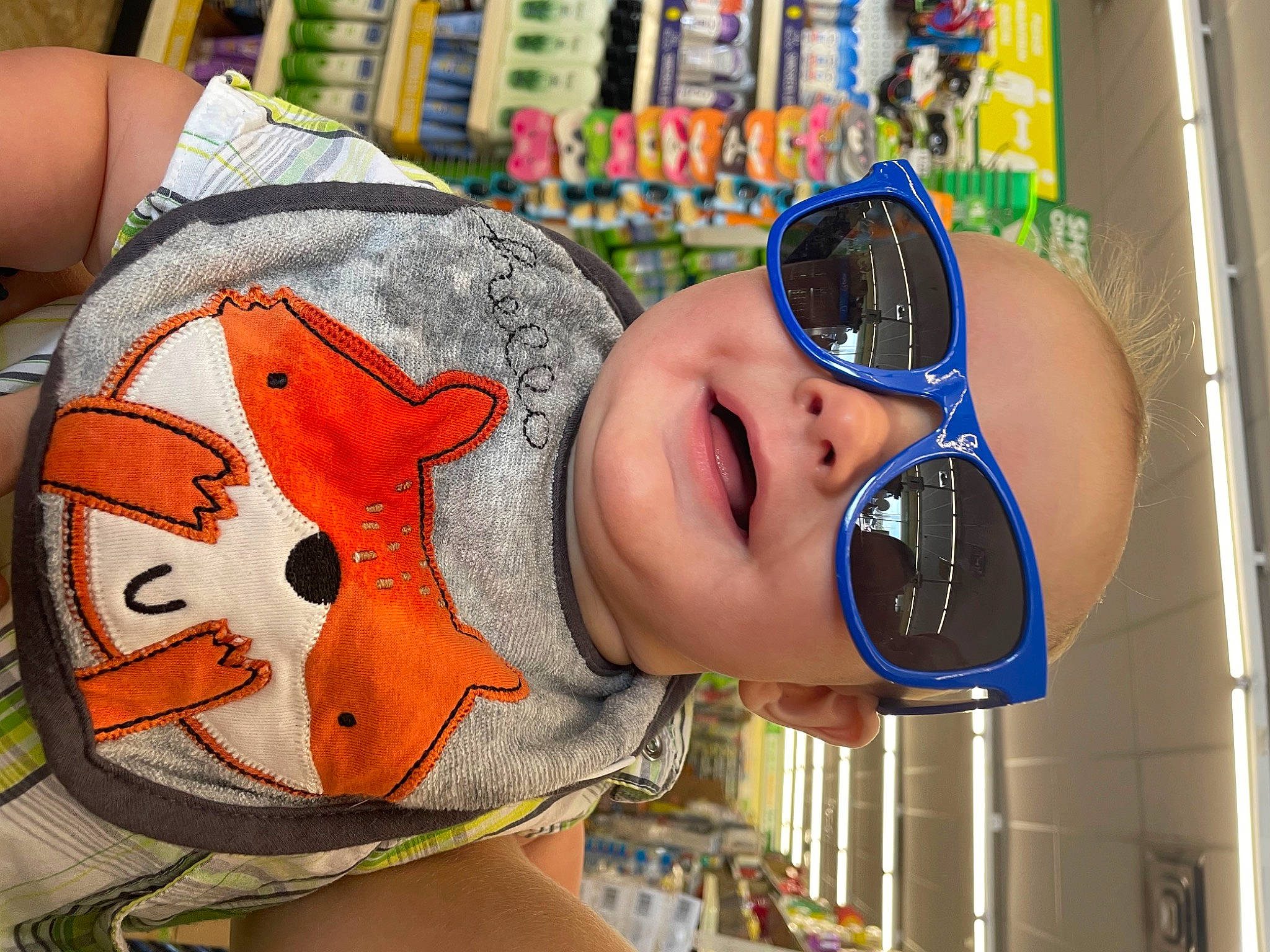 Colton is registered to the contest to win money with this photo: baby, baby_toddler_clothing, cap, child, eyewear, fashion_accessory, fun, goggles, happy, hat, headgear, leisure, orange, person, personal_protective_equipment, product, recreation, selfie, sunglasses, toddler
