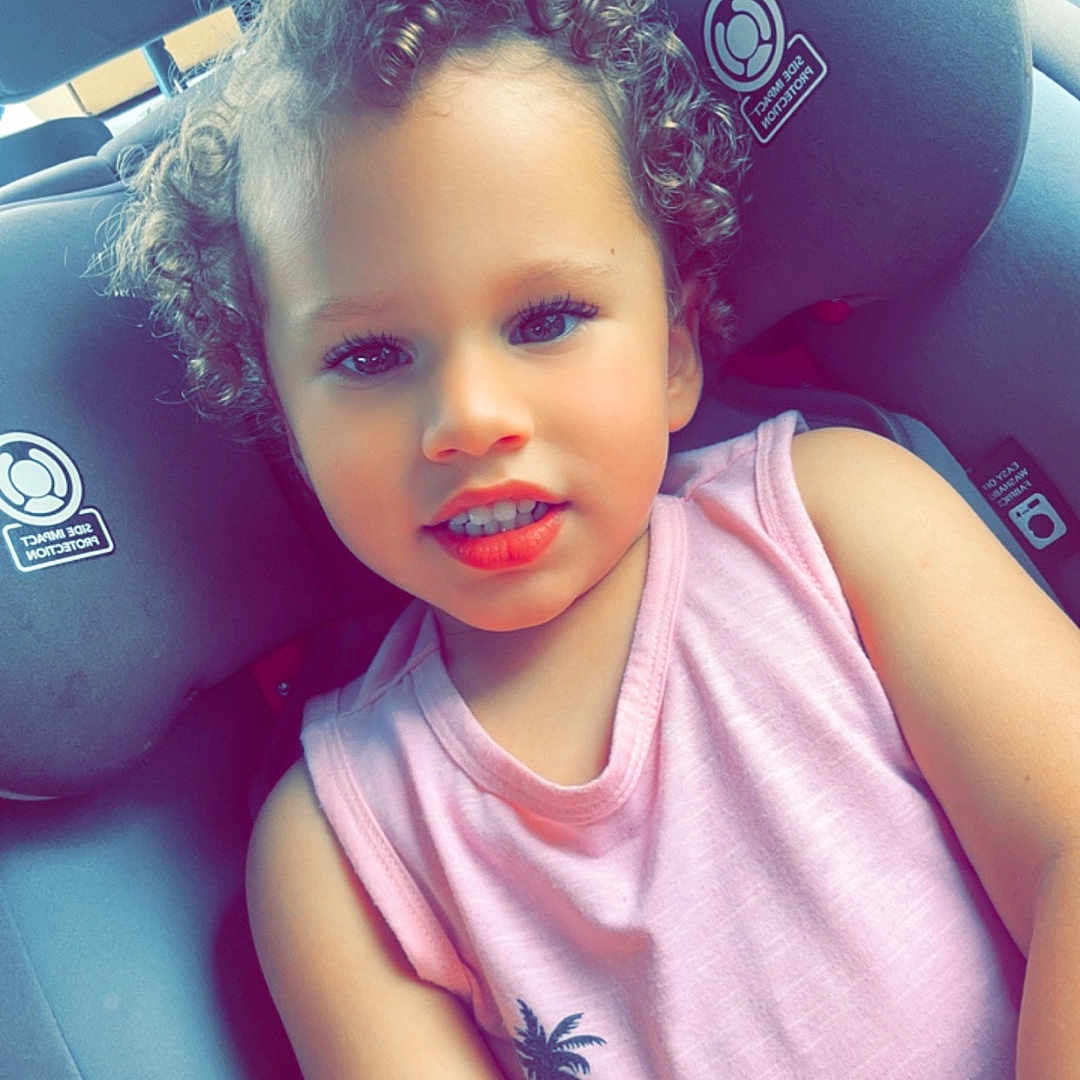 Joseph joined the competition — help win amazing prizes! car, car_interior, carseat, child, clothing, cushion, face, female, girl, hair, happy, head, homedecor, person, photography, portrait, smile, t_shirt, transportation, vehicle