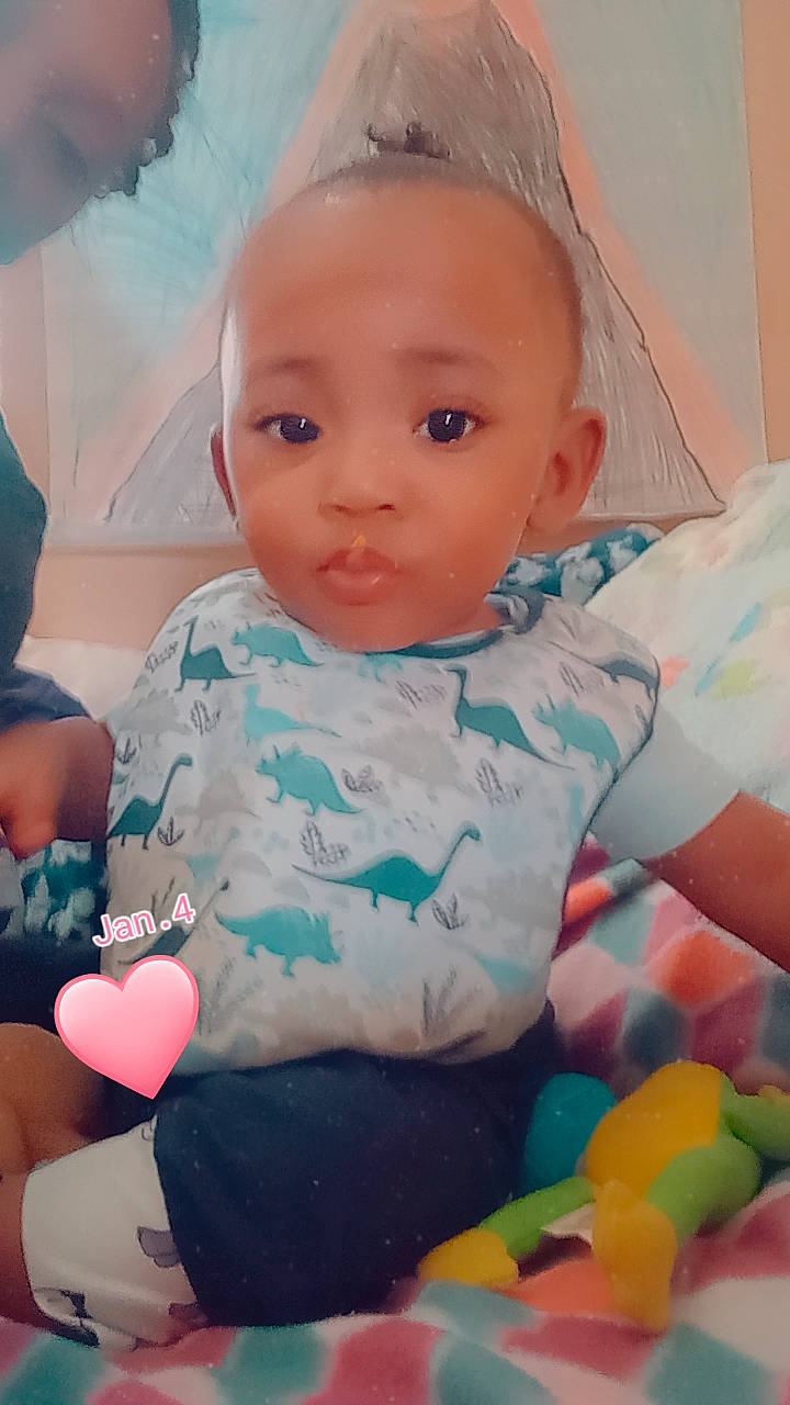 Zion joined the competition — help win amazing prizes! arm, baby_toddler_clothing, cheek, eye, facial_expression, finger, hairstyle, happy, head, human, human_body, iris, mouth, nose, organ, person, pink, product, skin, sleeve