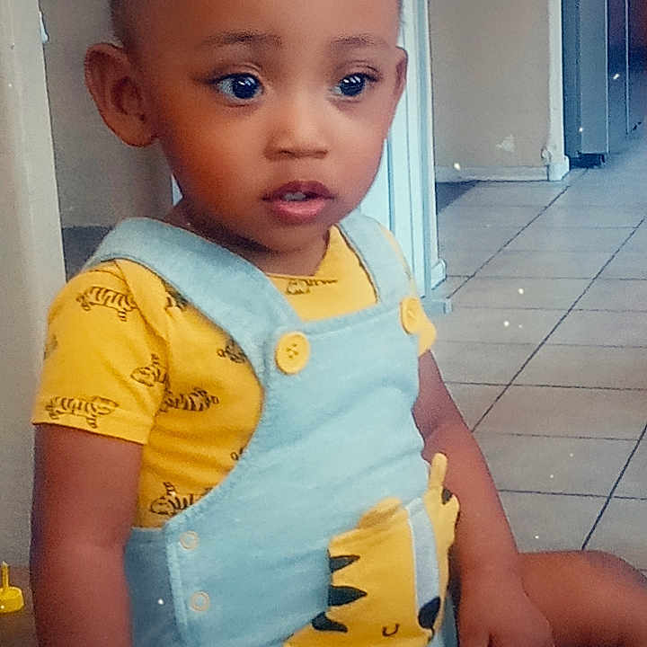 Zion joined the competition — help win amazing prizes! applique, baby, bodypart, clothing, crawling, door, dress, face, finger, glove, hand, head, pattern, person, photography, portrait, shorts, sitting, t_shirt, vest