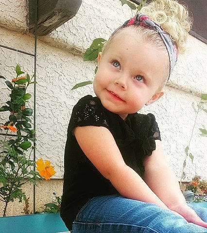 Kaitlyn is registered to the contest to win money with this photo: child, child_model, eye, girl, hair_accessory, headband, headgear, human_hair_color, infant, person, skin, smile, toddler