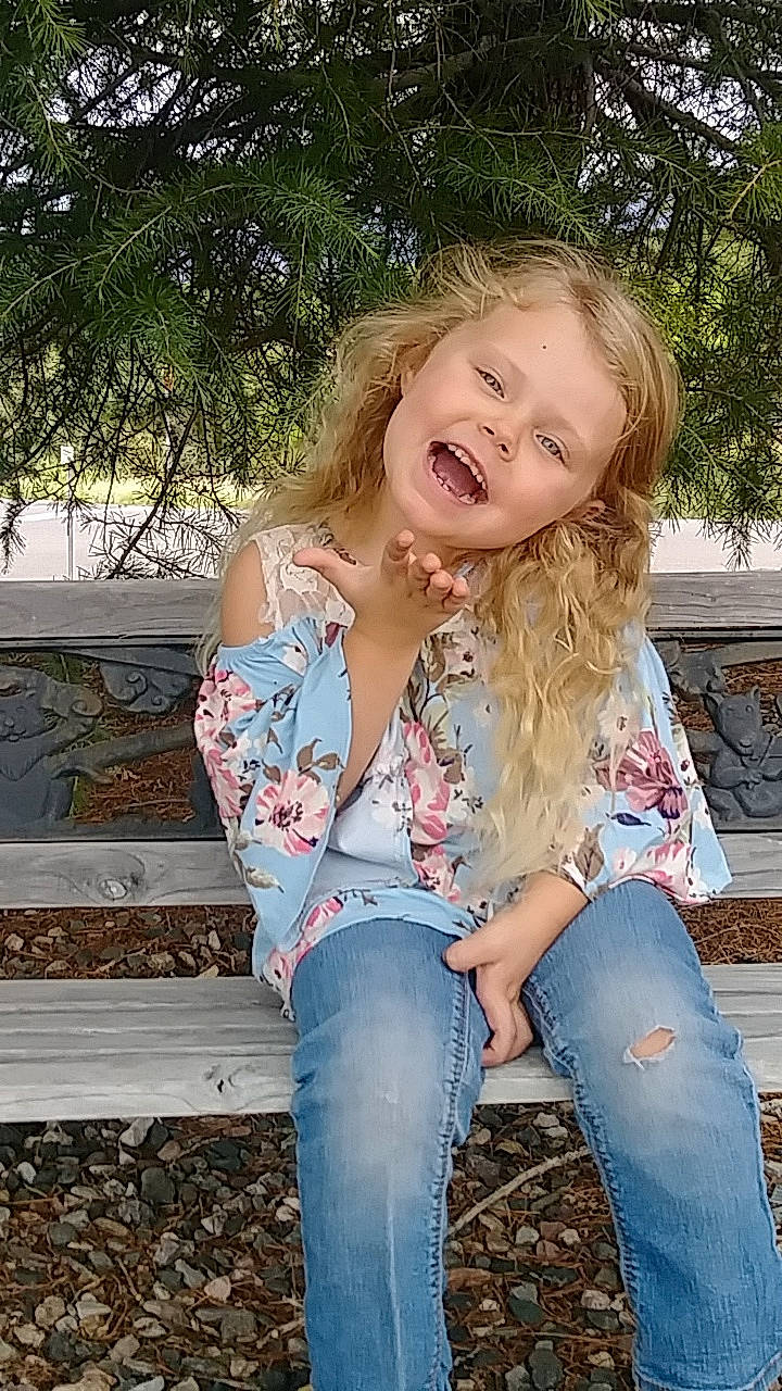 Kaitlyn joined the competition — help win amazing prizes! beauty, blond, child_model, clothing, denim, grass, hair, jeans, long_hair, person, photo_shoot, photography, sitting, smile, textile