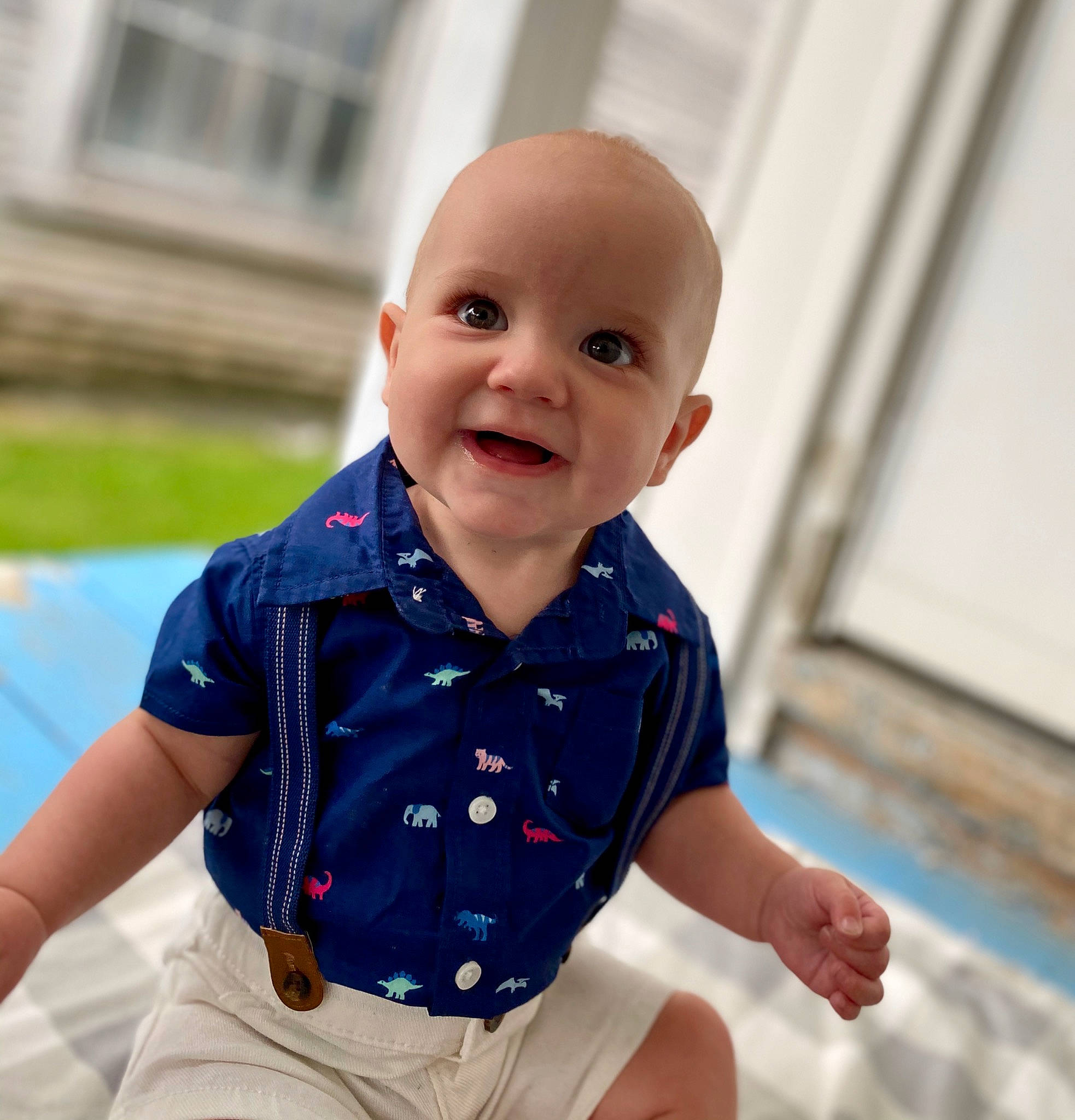 Lincoln is registered to the contest to win money with this photo: arm, baby, blue, cheek, child, cool, eye, face, facial_expression, head, nose, outerwear, people, person, product, sitting, skin, sleeve, smile, summer
