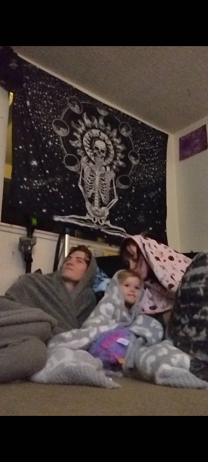 Araya is registered to the contest to win money with this photo: baby, child, comfort, couch, event, fun, lamp, lap, lighting_accessory, linens, living_room, ornament, pattern, person, picture_frame, room, sitting, toddler, tree, under_exposed