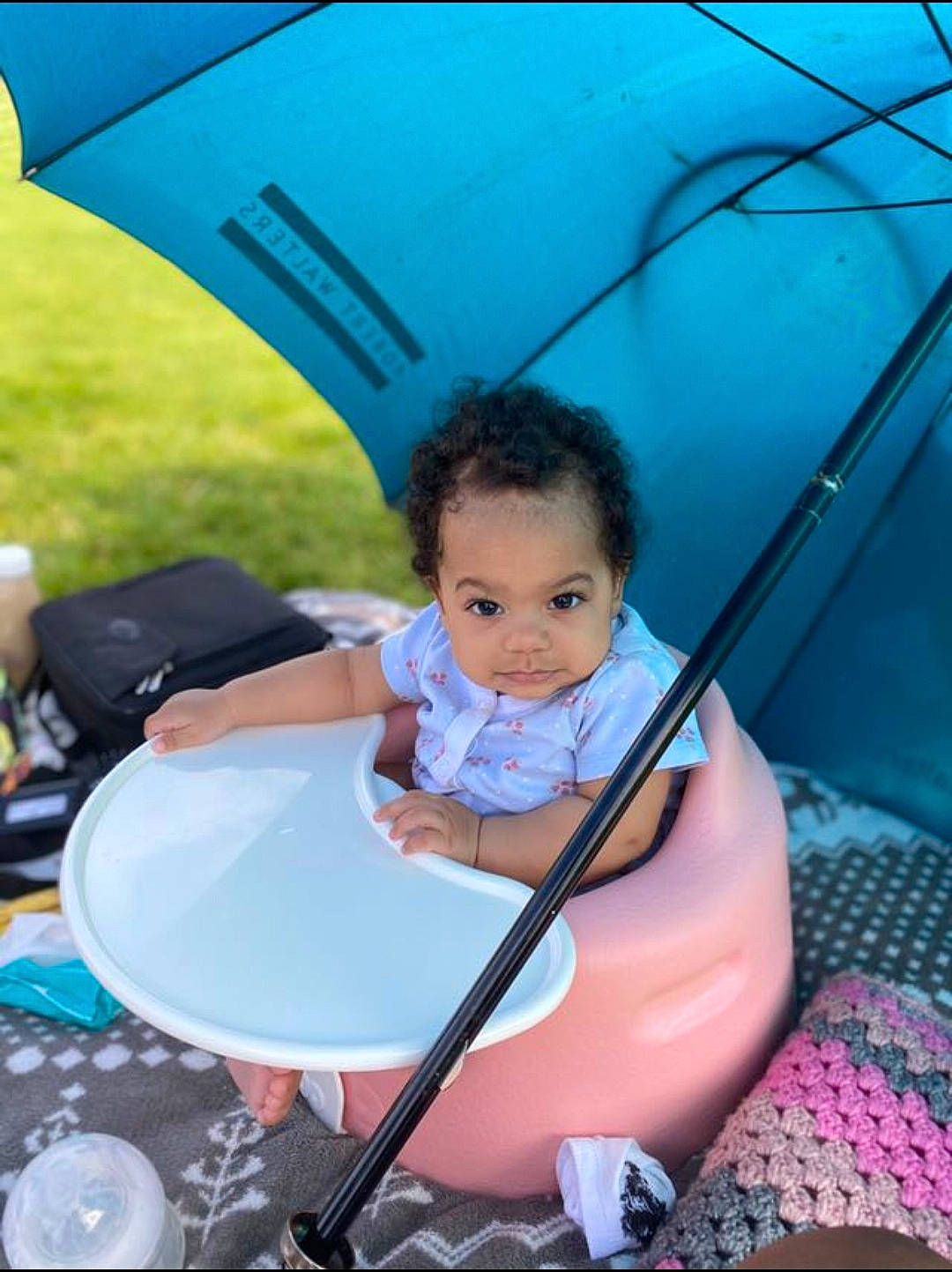 Marlia is registered to the contest to win money with this photo: azure, baby, baby_products, blue, chair, child, electric_blue, fun, grass, happy, leisure, outdoor_furniture, people_in_nature, person, photograph, recreation, sitting, smile, snapshot, toddler