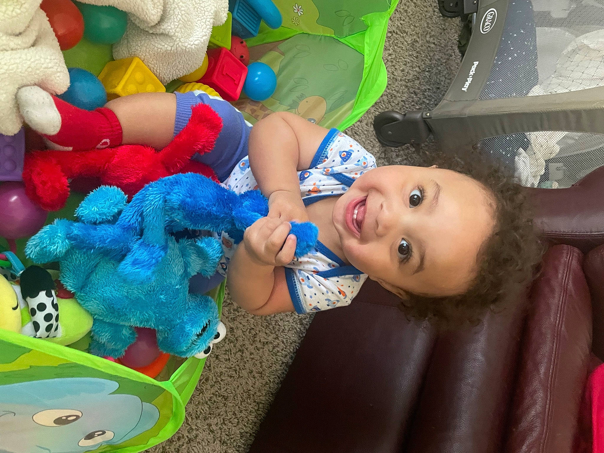 Xavier is registered to the contest to win money with this photo: baby, baby_toddler_clothing, child, electric_blue, event, fun, green, happy, headgear, joy, leisure, organ, party_supply, person, product, room, smile, stuffed_toy, t_shirt, textile