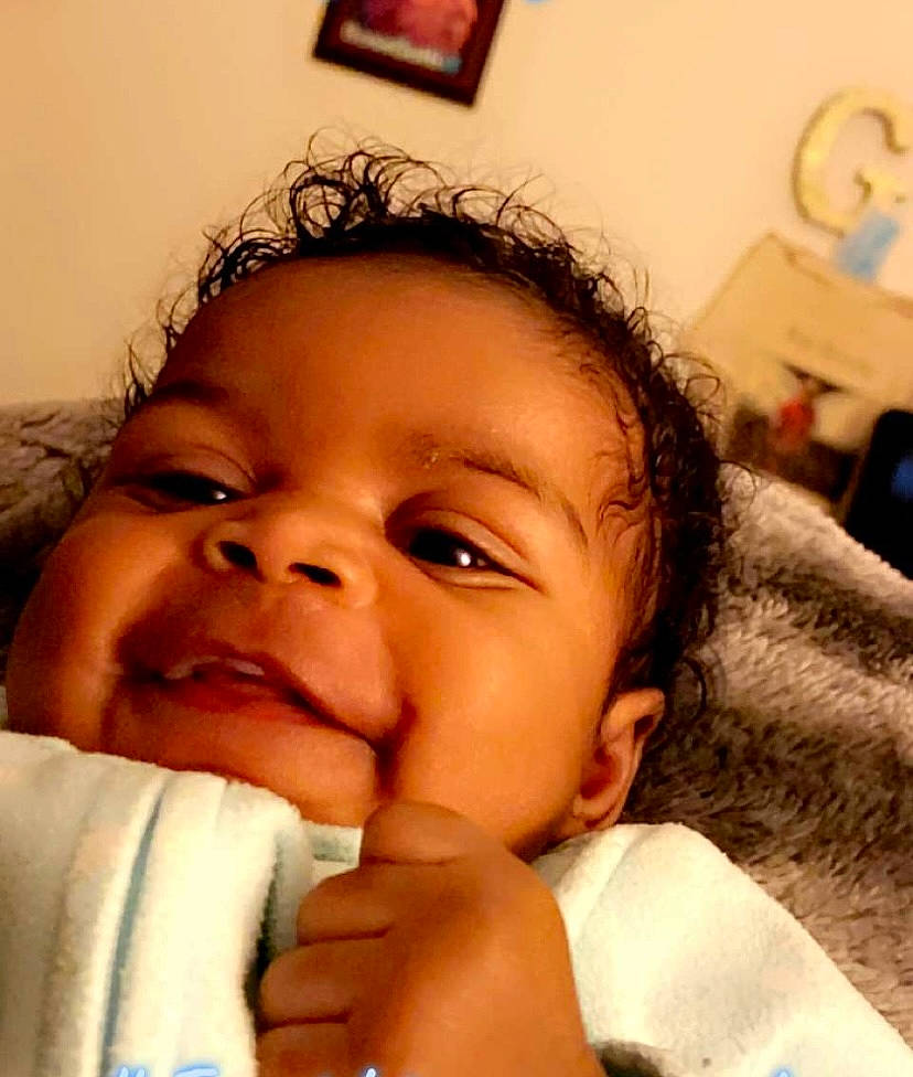 Essence is registered to the contest to win money with this photo: baby, cheek, child, comfort, ear, eyelash, facial_expression, fun, gesture, happy, lip, mouth, nose, organ, person, picture_frame, skin, smile, thumb, toddler