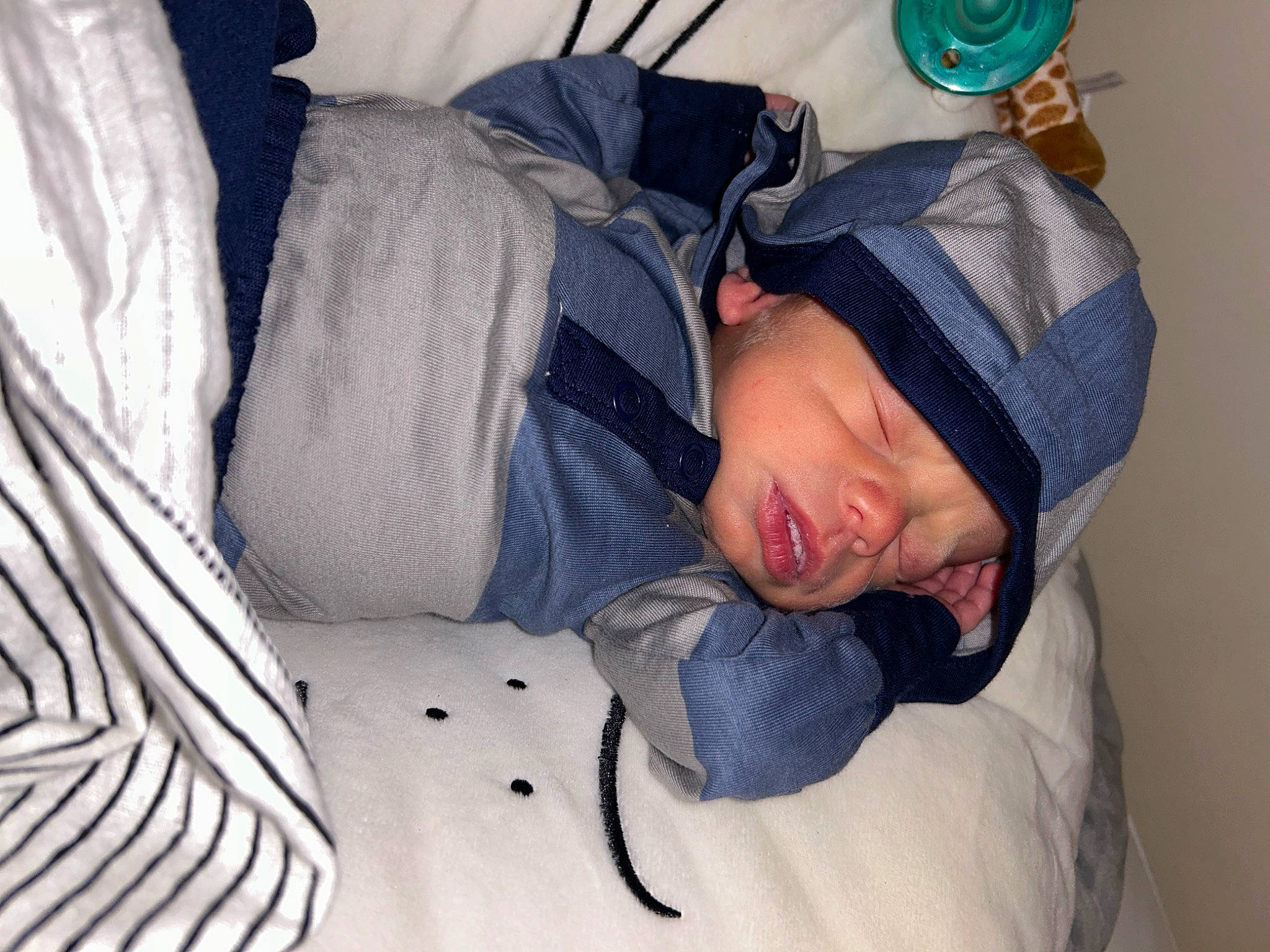 Chance is registered to the contest to win money with this photo: baby, baby_products, baby_sleeping, baby_toddler_clothing, bedding, bedtime, child, comfort, headwear, linens, nap, person, room, sitting, sleep, sleeve, textile, toddler, winter