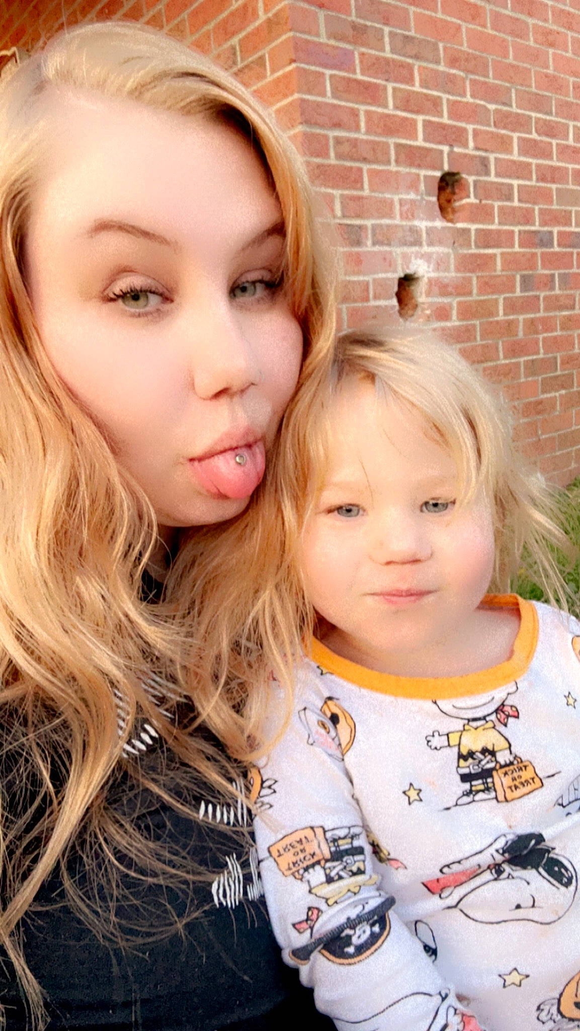 Aleiyah is registered to the contest to win money with this photo: blond, brick, brickwork, brown_hair, cheek, child, chin, eye, eyelash, face, fun, grass, happy, head, iris, layered_hair, lip, nose, person, sleeve