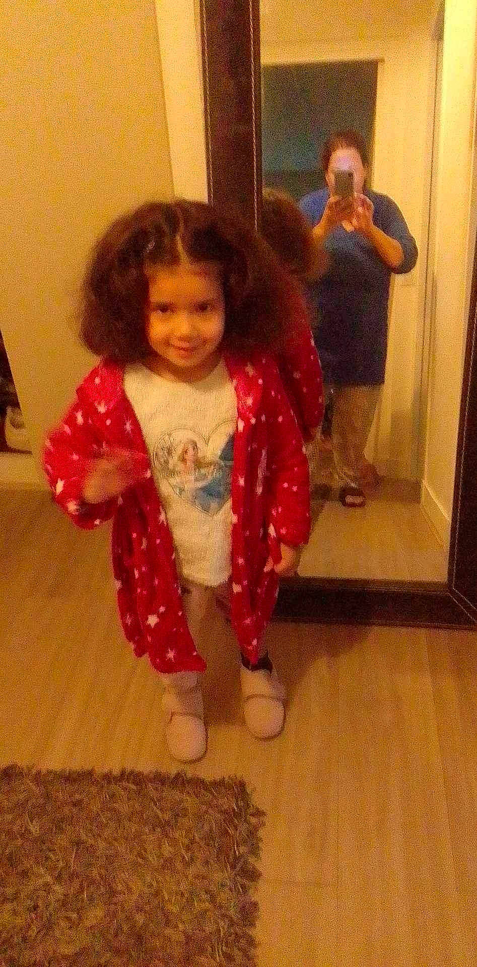 Fleur participe au concours pour gagner de l'argent avec cette photo : arm, baby_toddler_clothing, cheek, floor, flooring, fun, hair, happy, hardwood, head, joy, leg, mirror, outerwear, person, skin, sleeve, smile, standing, thumb