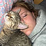 Milo Anthony is registered to the contest to win money with this photo: cat, person, sleeping, indoor, tabby_cat, pillow, cozy, closeup, nap, cuddle, face, fur, animal, rest, blanket, bed, casual, hoodie, comfort, relaxation