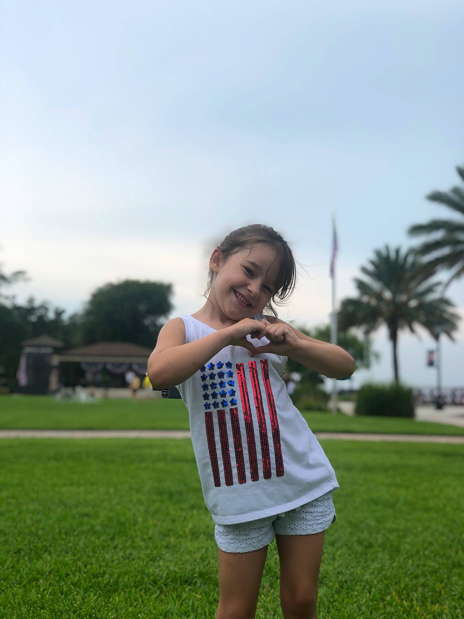 Tuesday is registered to the contest to win money with this photo: child, finger, fun, grass, happy, joint, joy, lawn, leisure, meadow, person, photography, shoulder, smile, summer, vacation