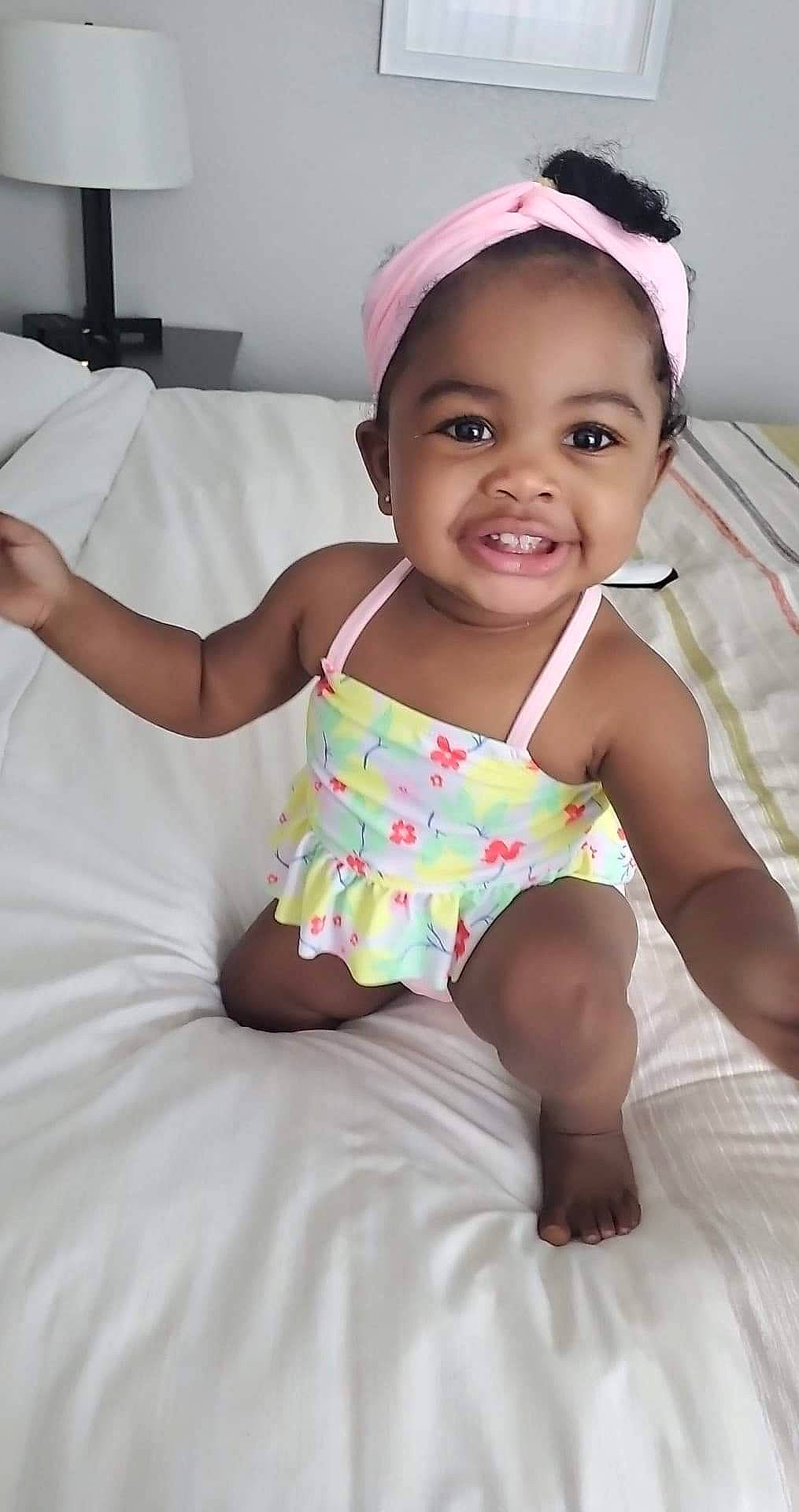 Sydney joined the competition — help win amazing prizes! baby, baby_toddler_clothing, cheek, child, comfort, eye, face, facial_expression, finger, fun, hairstyle, happy, joy, mouth, person, pink, skin, sleeve, smile, textile