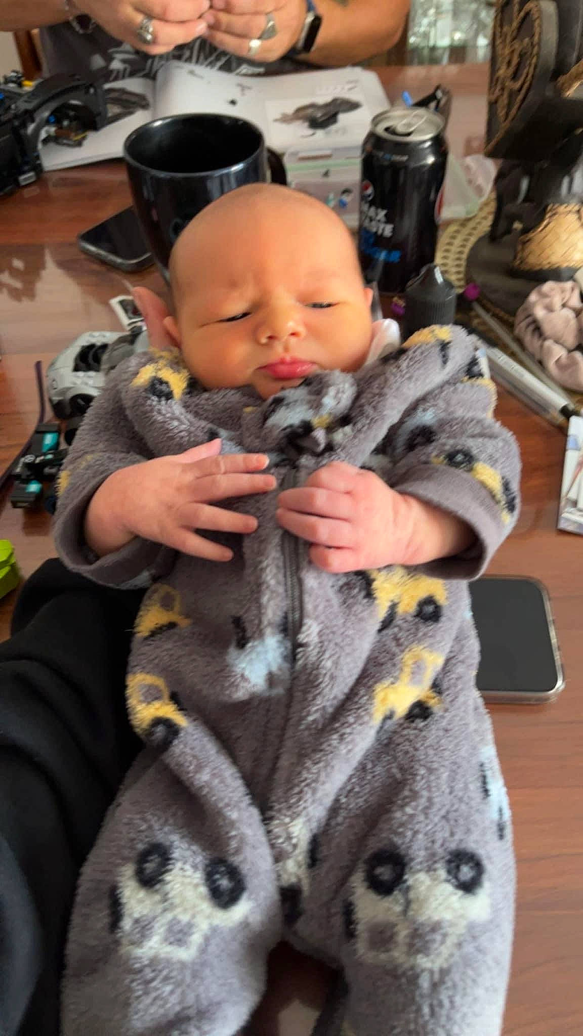 Cayde joined the competition — help win amazing prizes! baby, baby_carriage, baby_products, child, costume, flooring, fun, fur, military_camouflage, pattern, person, room, sitting, skin, stuffed_toy, table, toddler, toy