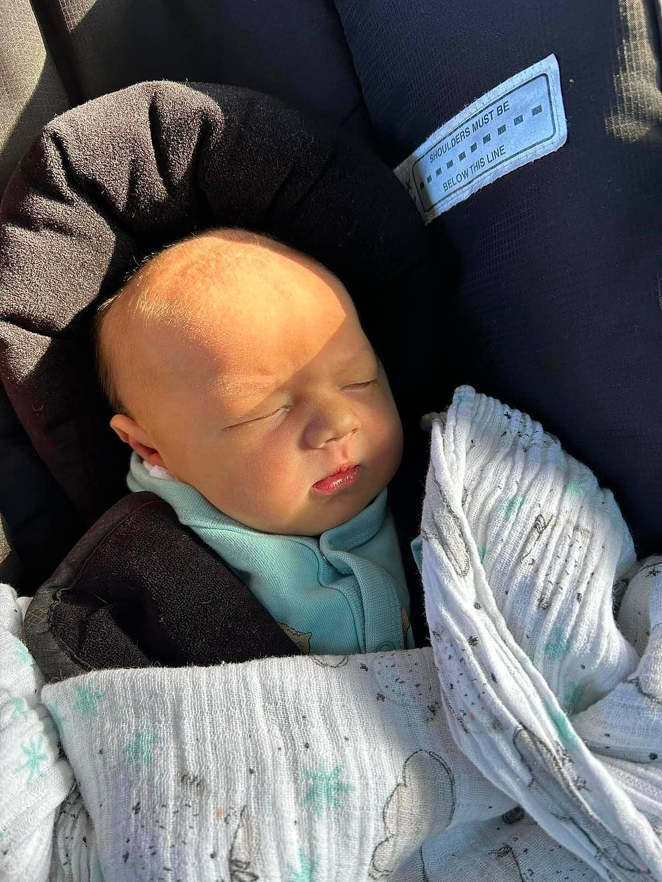 Cayde is registered to the contest to win money with this photo: baby, baby_in_car_seat, baby_products, baby_sleeping, baby_toddler_clothing, cap, cheek, child, chin, comfort, cool, face, facial_expression, headgear, linens, person, sitting, skin, sleeve, textile