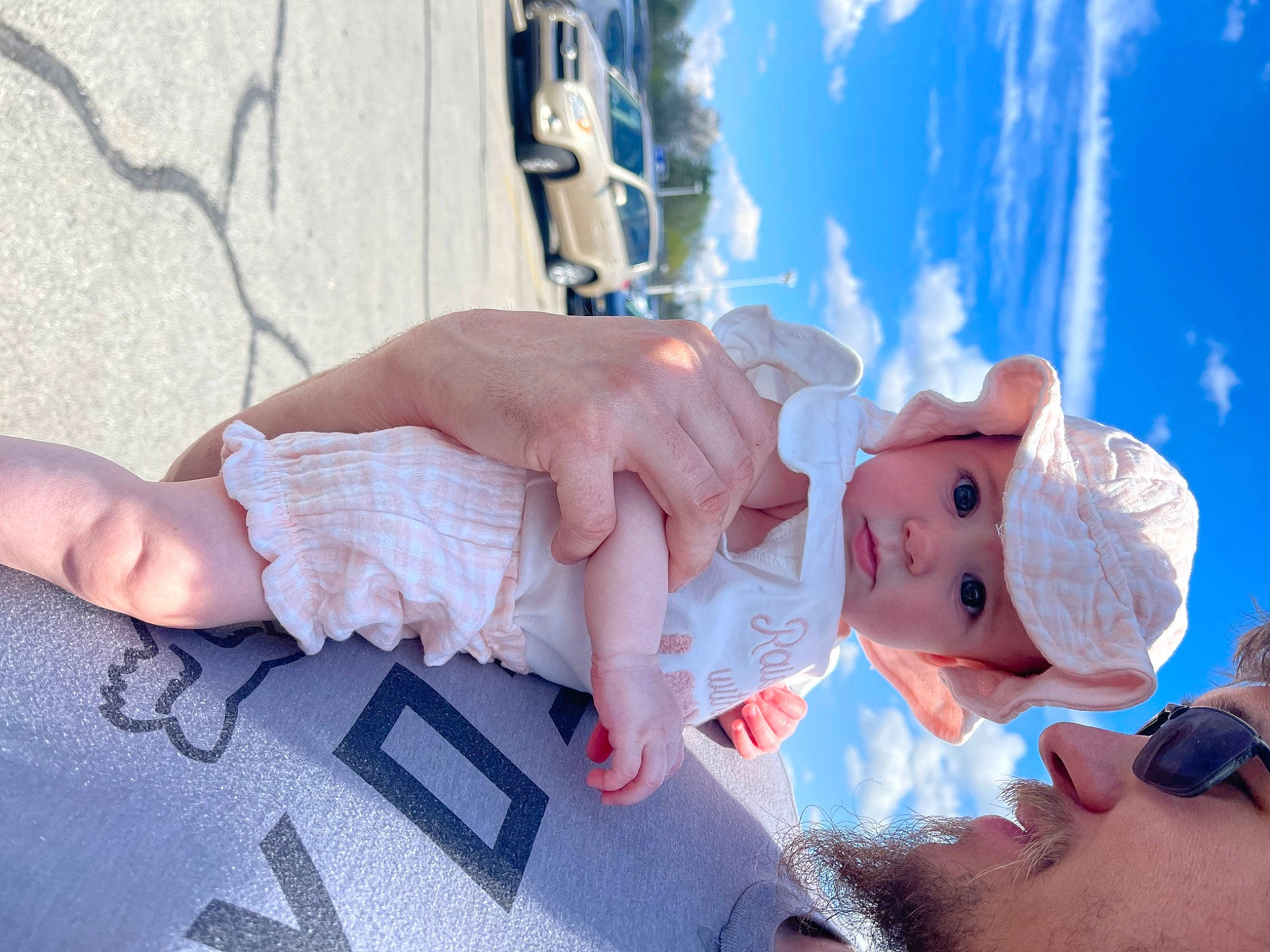 Olivia is registered to the contest to win money with this photo: azure, baby, blue, child, cloud, cumulus, event, finger, fun, gesture, hand, happy, hat, headwear, leisure, nail, person, skin, sky, thumb