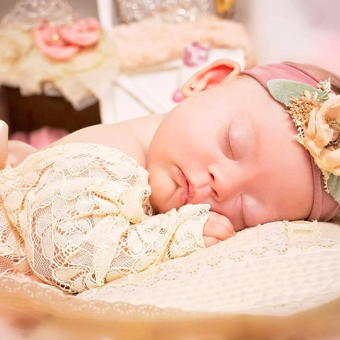 Saraya is registered to the contest to win money with this photo: baby, baby_sleeping, child, comfort, drinkware, eyelash, fashion_accessory, finger, hair_accessory, happy, headband, headgear, headpiece, headwear, jewellery, linens, peach, person, pink, skin
