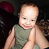 Santiago is registered to the contest to win money with this photo: arm, baby, blanket, casual, child, couch, cute, exercise_ball, face, green_outfit, happy, home, indoors, leg, person, portrait, sitting, skin, smiling, toddler