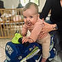 Giulia participe au concours pour gagner de l'argent avec cette photo : baby, child, toy_motorbike, indoor, person, hand, smile, play, floor, window, crib, clothing, foot, expression, support, home, furniture, tattoo, happy, cute