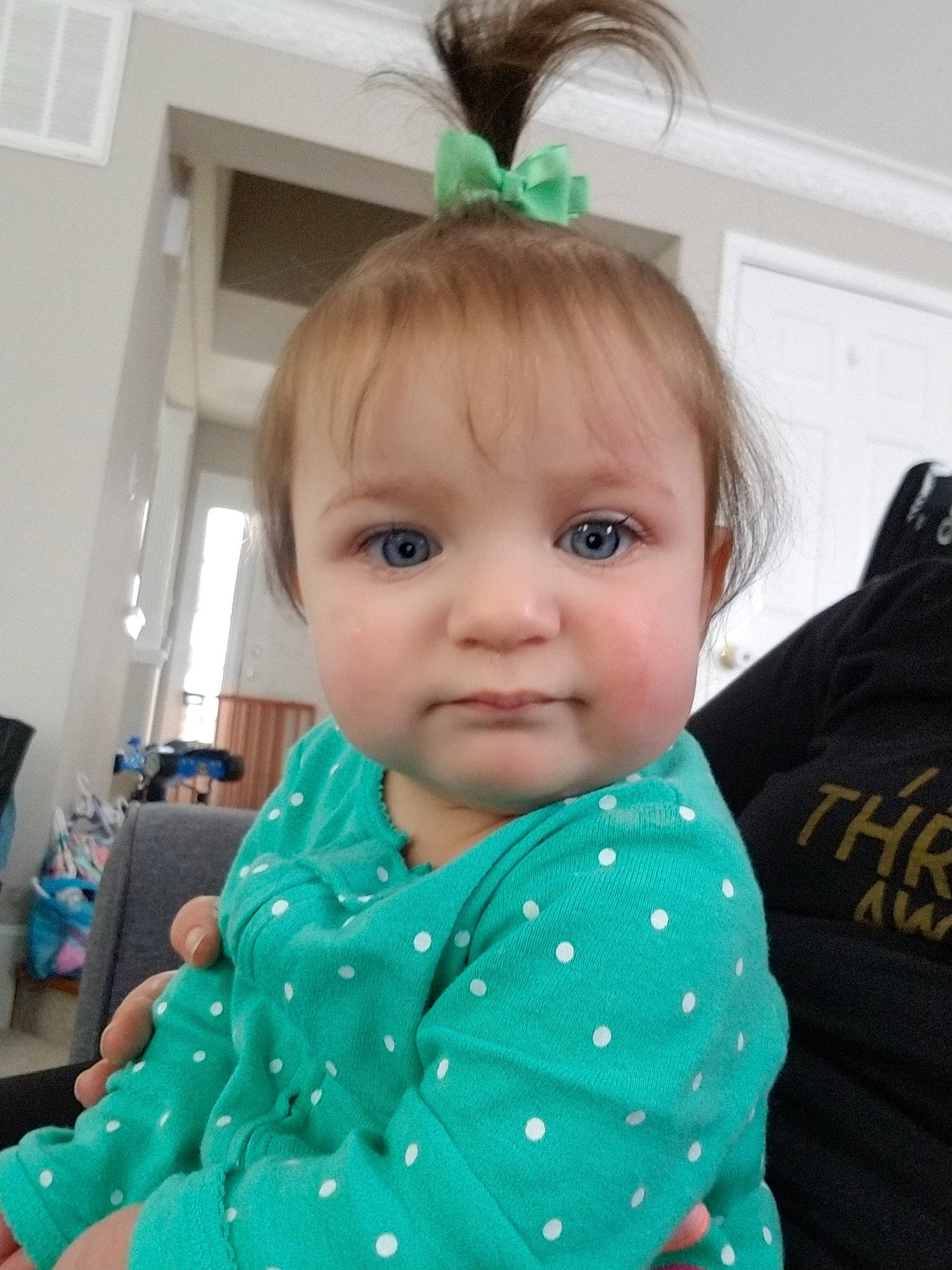 Arwen is registered to the contest to win money with this photo: baby, cheek, child, ear, eye, face, forehead, green, hair, head, iris, lip, neck, outerwear, pattern, person, polka_dot, skin, sleeve, smile