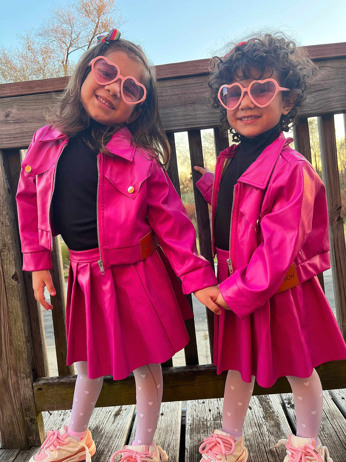 Melisa joined the competition — help win amazing prizes! boy, child, children, curly_hair, fashion, girl, happy, heart_sunglasses, holding_hands, long_hair, outdoor, pink_jacket, pink_skirt, playful, posing, smiling, sneakers, sunset, white_tights, wooden_deck