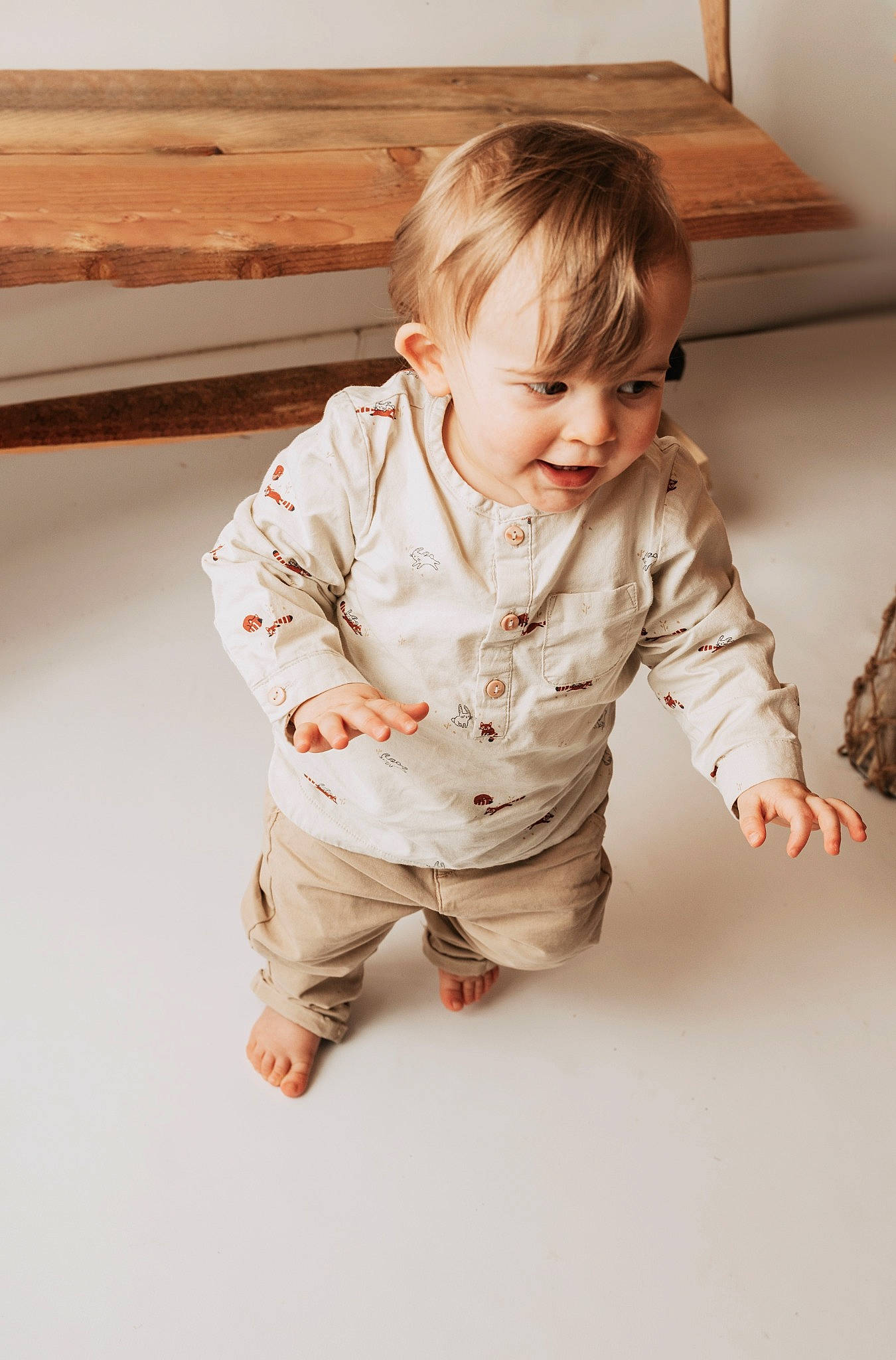 Eden participe au concours pour gagner de l'argent avec cette photo : baby, baby_toddler_clothing, child, collar, comfort, dress_shirt, floor, flooring, foot, fun, happy, hardwood, leg, pattern, person, sitting, skin, sleeve, smile, toddler