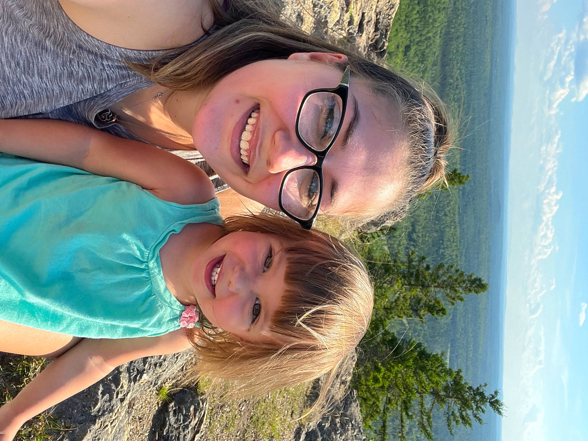 Noelle is registered to the contest to win money with this photo: body_of_water, cool, eyewear, gesture, grass, happy, hat, joy, leisure, light, mouth, neck, nose, organ, people_in_nature, person, photograph, skin, sky, smile