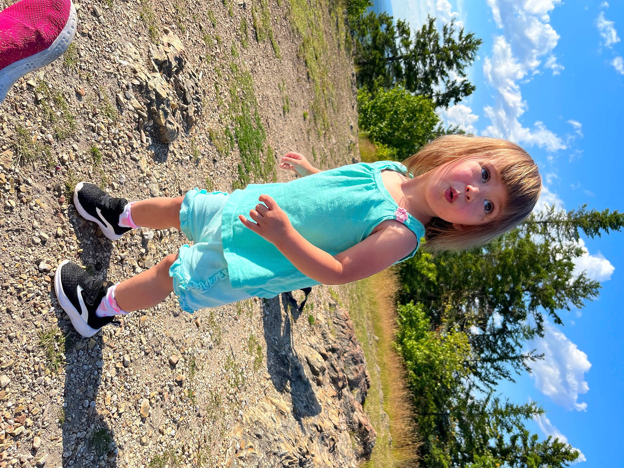 Noelle is registered to the contest to win money with this photo: azure, beauty, cloud, electric_blue, footwear, fun, grass, grassland, happy, human_leg, landscape, leisure, people_in_nature, person, plant, recreation, sky, smile, thigh, toddler