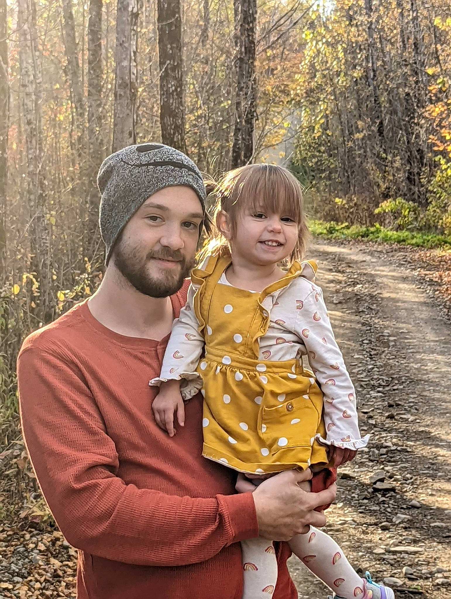 Noelle joined the competition — help win amazing prizes! beard, cap, child, fun, grass, happy, headwear, joy, landscape, leisure, nature, people, people_in_nature, person, plant, sandal, sitting, smile, soil, toddler