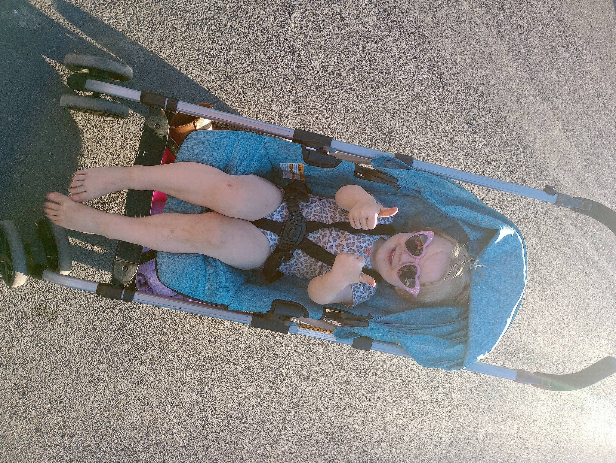 Annie Oaklee joined the competition — help win amazing prizes! ankle, asphalt, auto_part, automotive_exterior, baby_products, boot, bumper, concrete, costume, electric_blue, foot, fun, human_leg, knee, leisure, person, recreation, shadow, smile, thigh