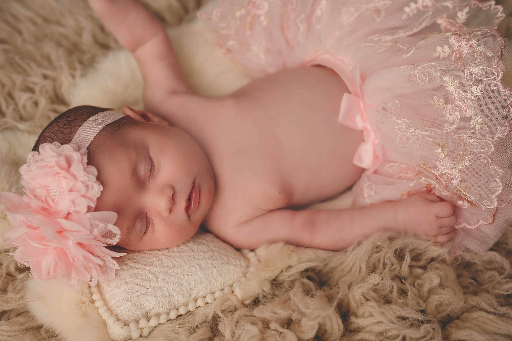 Ariana is registered to the contest to win money with this photo: baby, baby_sleeping, baby_toddler_clothing, cheek, clothing, comfort, eye, eyebrow, eyelash, face, facial_expression, finger, hand, head, headgear, headwear, iris, lip, neck, person