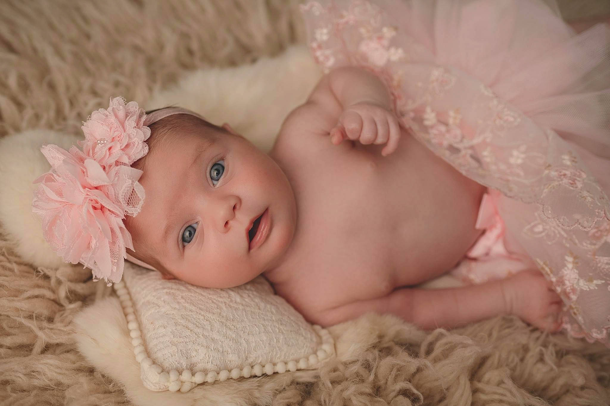 Ariana joined the competition — help win amazing prizes! baby, baby_toddler_clothing, cheek, child, close_up, comfort, embellishment, eye, eyelash, fashion_accessory, grass, hair_accessory, head, headgear, headwear, iris, lip, person, pink, skin