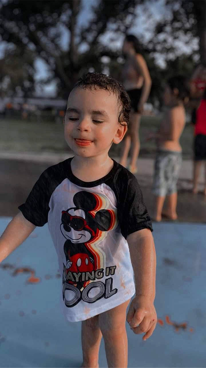 Xaiden is registered to the contest to win money with this photo: active_shirt, baby_toddler_clothing, child, cool, event, eyewear, flash_photography, fun, happy, joint, leisure, mammal, person, recreation, shorts, sleeve, smile, standing, t_shirt, toddler